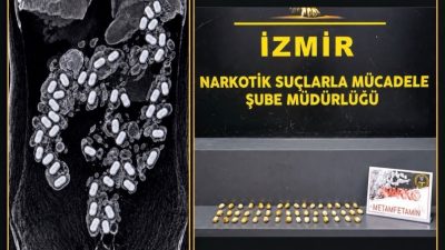 İzmir Adnan Menderes Havalimanı’nda polis ekipleri tarafından yakalanan uyuşturucu kuryesinin
